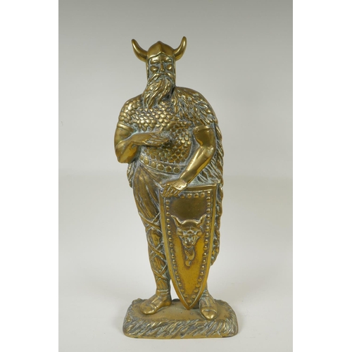 141 - A figural brass doorstop in the form of a viking, 56cm high