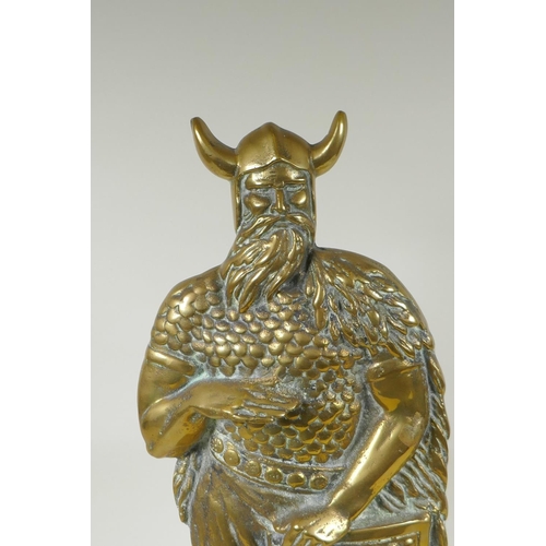 141 - A figural brass doorstop in the form of a viking, 56cm high