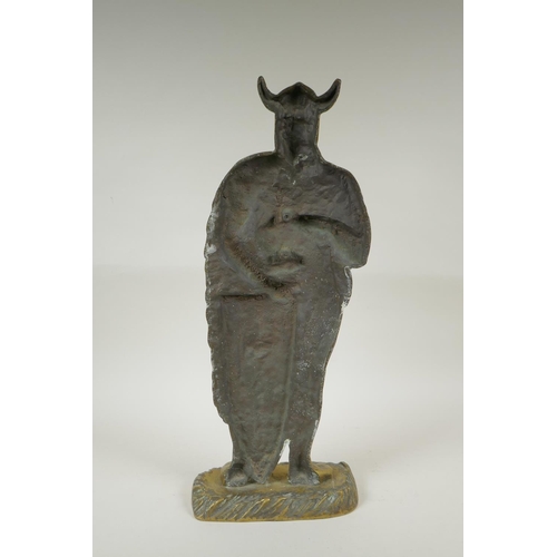 141 - A figural brass doorstop in the form of a viking, 56cm high