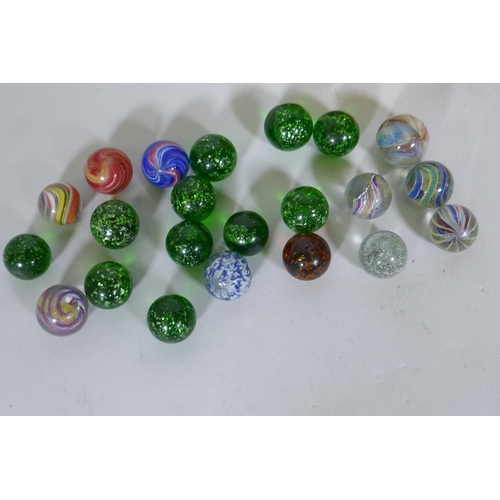 143 - A small collection of antique marbles with spiral twist and silver flecked decoration, 2.3cm diamete... 