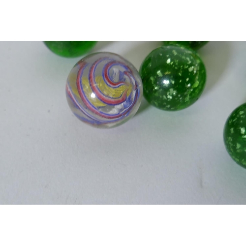 143 - A small collection of antique marbles with spiral twist and silver flecked decoration, 2.3cm diamete... 