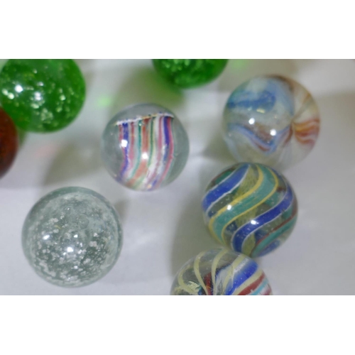 143 - A small collection of antique marbles with spiral twist and silver flecked decoration, 2.3cm diamete... 