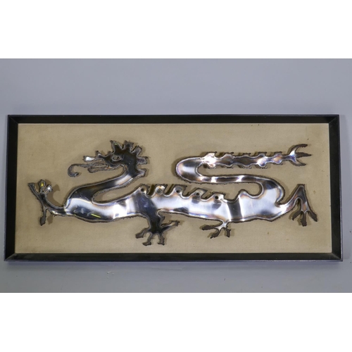 144 - A mid-century stainless steel dragon, framed, labelled verso, Marler Haley Ltd, Barnet, Herts, 73 x ... 