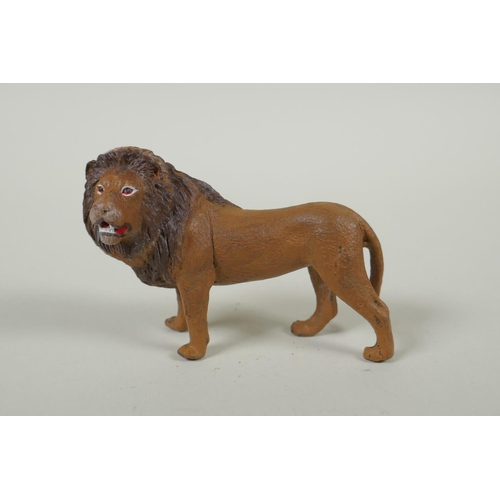 152 - An Austrian style cold painted bronze lion, after Bergmann, 10cm long