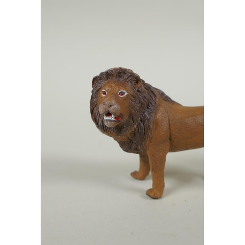 152 - An Austrian style cold painted bronze lion, after Bergmann, 10cm long