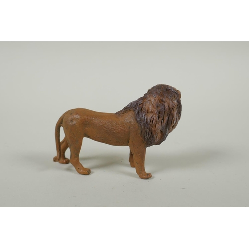 152 - An Austrian style cold painted bronze lion, after Bergmann, 10cm long