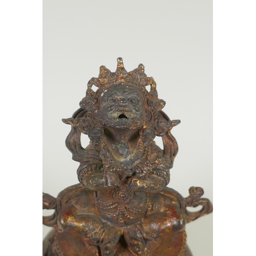 153 - A Tibetan gilt bronze censer and cover, the knop in the form of a wrathful deity, double vajra mark ... 