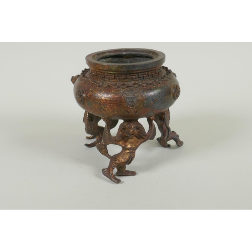 153 - A Tibetan gilt bronze censer and cover, the knop in the form of a wrathful deity, double vajra mark ... 