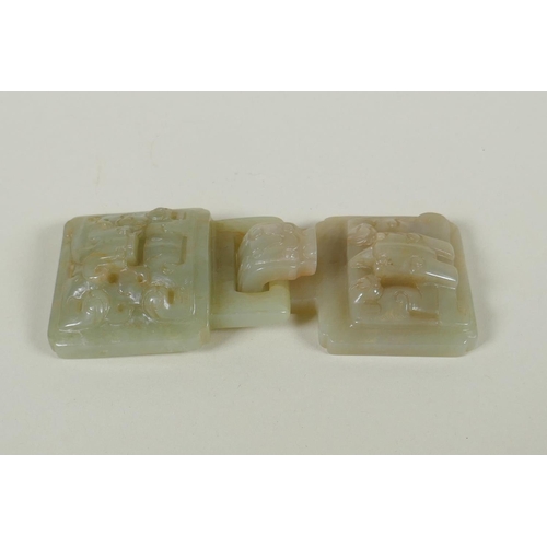 155 - A Chinese carved celadon jade belt buckle with dragon and phoenix decoration