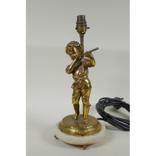 159 - A gilt plated metal figural table lamp of a child playing a flute, in the manner of Auguste Moreau, ... 