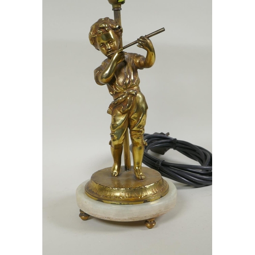 159 - A gilt plated metal figural table lamp of a child playing a flute, in the manner of Auguste Moreau, ... 