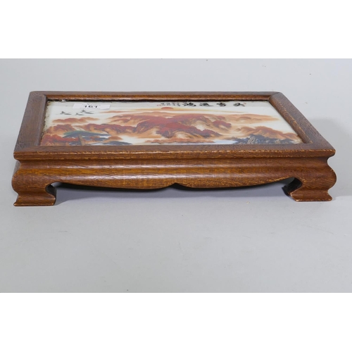 161 - A Chinese hardwood stand with inset porcelain panel, 29 x 20 x 5cm