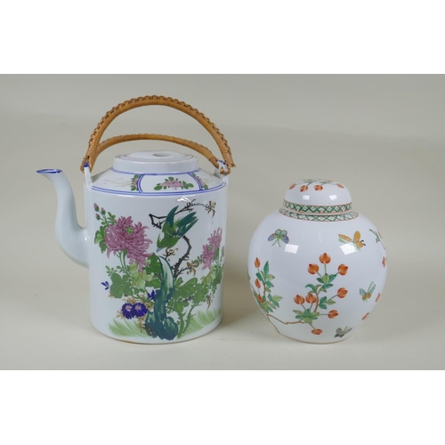 162 - A Chinese polychrome cylinder teapot decorated with birds and chrysanthemums, and a Cantonese porcel... 