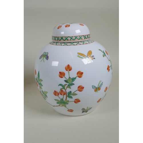 162 - A Chinese polychrome cylinder teapot decorated with birds and chrysanthemums, and a Cantonese porcel... 