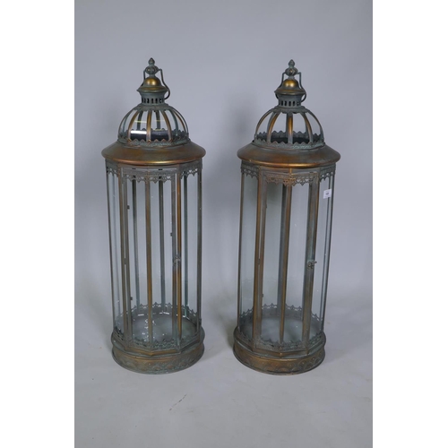 169 - A pair of large coppered metal lanterns, 86cm high