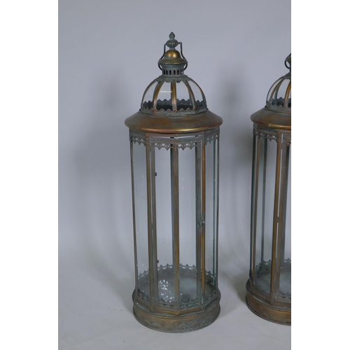 169 - A pair of large coppered metal lanterns, 86cm high