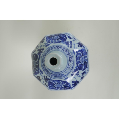 170 - A Chinese blue and white porcelain octagonal vase with scrolling floral and all over script decorati... 