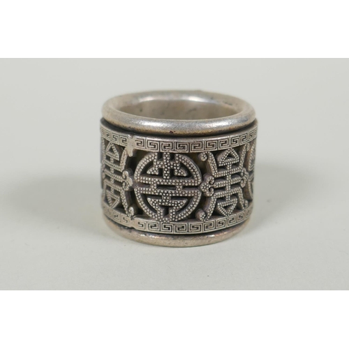 175 - A Chinese white metal archers thumb ring with revolving mount, decorated with auspicious symbols, an... 