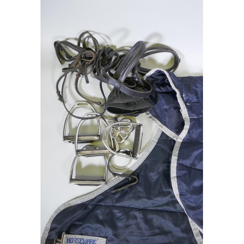 176 - A quantity of equestrian equipment including Amigo Horseware stable/under blanket, Equigel saddle pa... 