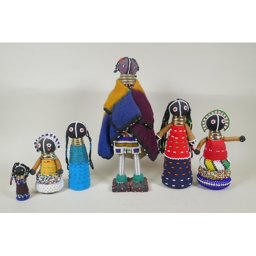 179 - A collection of South African Ndebele bead work dolls, largest 36cm high