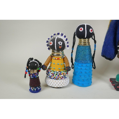 179 - A collection of South African Ndebele bead work dolls, largest 36cm high