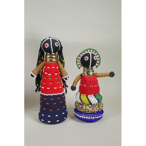 179 - A collection of South African Ndebele bead work dolls, largest 36cm high