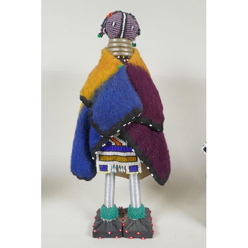 179 - A collection of South African Ndebele bead work dolls, largest 36cm high