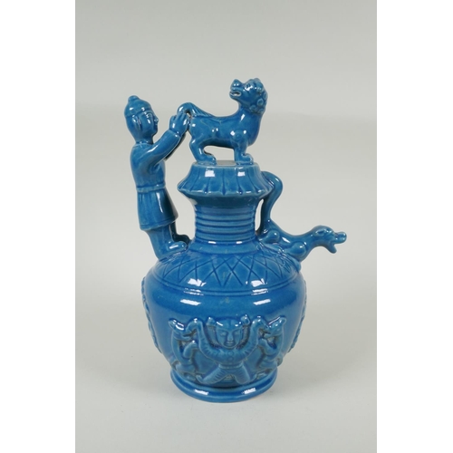 183 - A Chinese teal glazed porcelain pourer decorated with Fo dogs and figures, mark to base, 29cm high