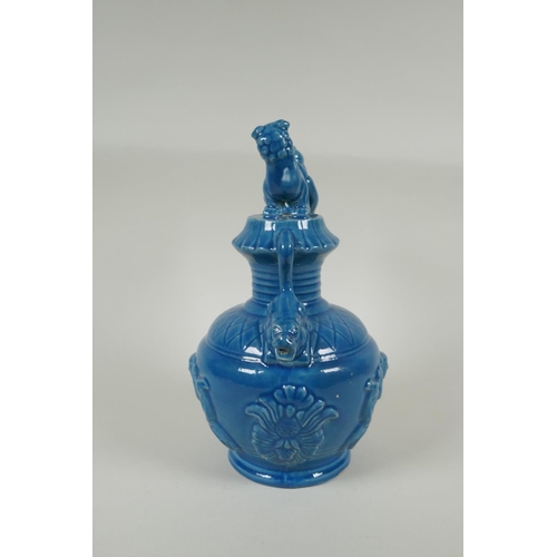 183 - A Chinese teal glazed porcelain pourer decorated with Fo dogs and figures, mark to base, 29cm high