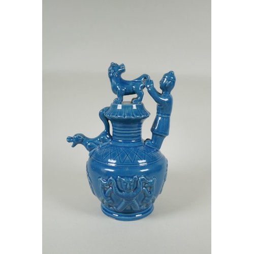 183 - A Chinese teal glazed porcelain pourer decorated with Fo dogs and figures, mark to base, 29cm high