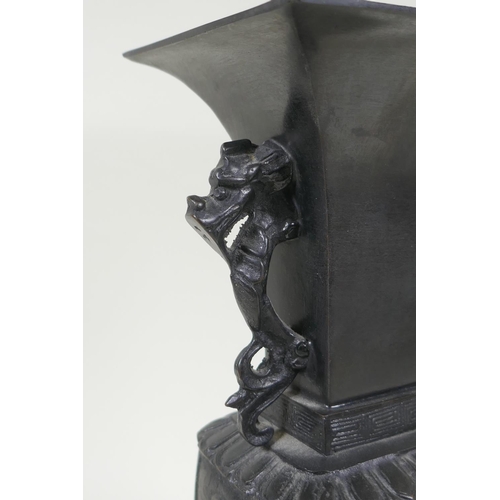 192 - A Japanese bronze vase with twin dragon handles and raised dragon decoration to the side, indistinct... 