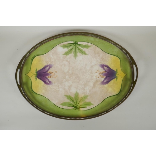 193 - An antique porcelain tray with pierced brass gallery, decorated with Art Nouveau style flowers, an a... 