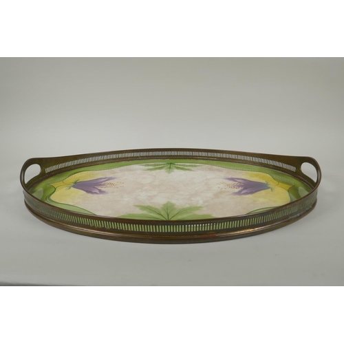 193 - An antique porcelain tray with pierced brass gallery, decorated with Art Nouveau style flowers, an a... 