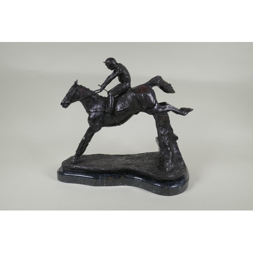 194 - A bronze figure of a horse and jockey, 32cm high