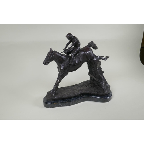 194 - A bronze figure of a horse and jockey, 32cm high