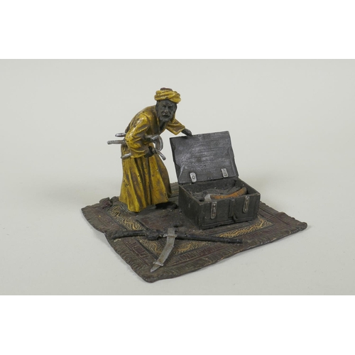 196 - In the manner of Bergmann, a cold painted bronze figure of an Arab armourer, 13 x 13cm