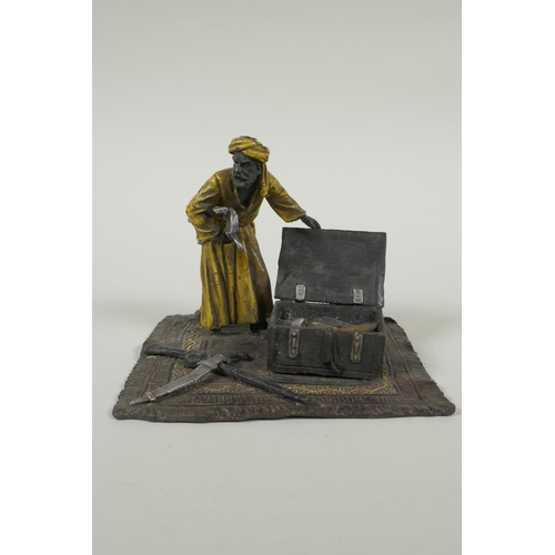 196 - In the manner of Bergmann, a cold painted bronze figure of an Arab armourer, 13 x 13cm