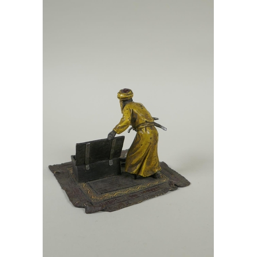 196 - In the manner of Bergmann, a cold painted bronze figure of an Arab armourer, 13 x 13cm