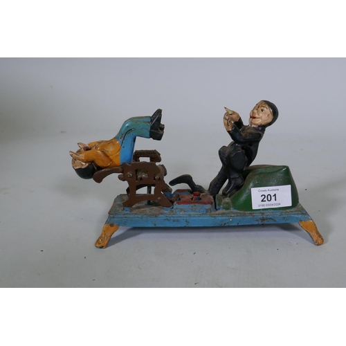 201 - A painted cast iron money box in the form of a dentist, 22cm long, 16cm high