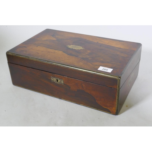 205 - A Victorian rosewood writing box with brass mounts, fitted interior with gilt tooled leather slope, ... 