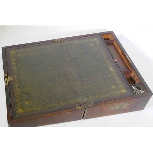 205 - A Victorian rosewood writing box with brass mounts, fitted interior with gilt tooled leather slope, ... 