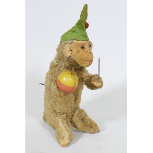 208 - A vintage clockwork monkey, 25cm high