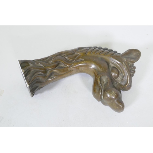 209 - Antique bronze mount in the form of a dragon's head, 17cm long