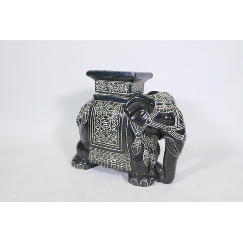 210 - A ceramic garden stool in the form of an elephant, 45cm high