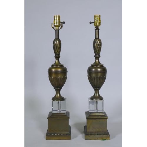 217 - A pair of bronzed and crystal glass table lamps, 63cm high