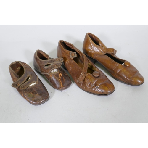 219 - A pair of late C19th/early C20th child's leather shoes, 12cm long, and another pair larger