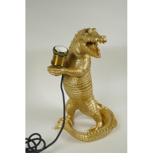 222 - A gilt composition lamp in the form of a crocodile, 38cm high