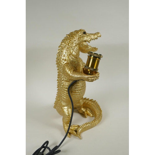 222 - A gilt composition lamp in the form of a crocodile, 38cm high