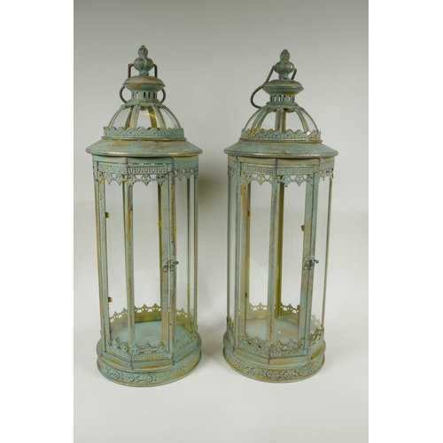 223 - A pair of gilt and verdigris metal lanterns, 59cm high