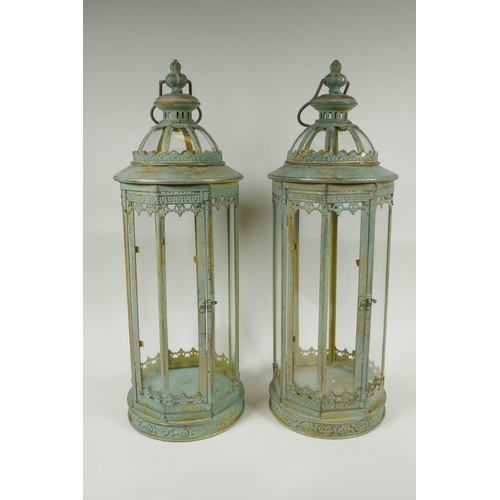 223 - A pair of gilt and verdigris metal lanterns, 59cm high